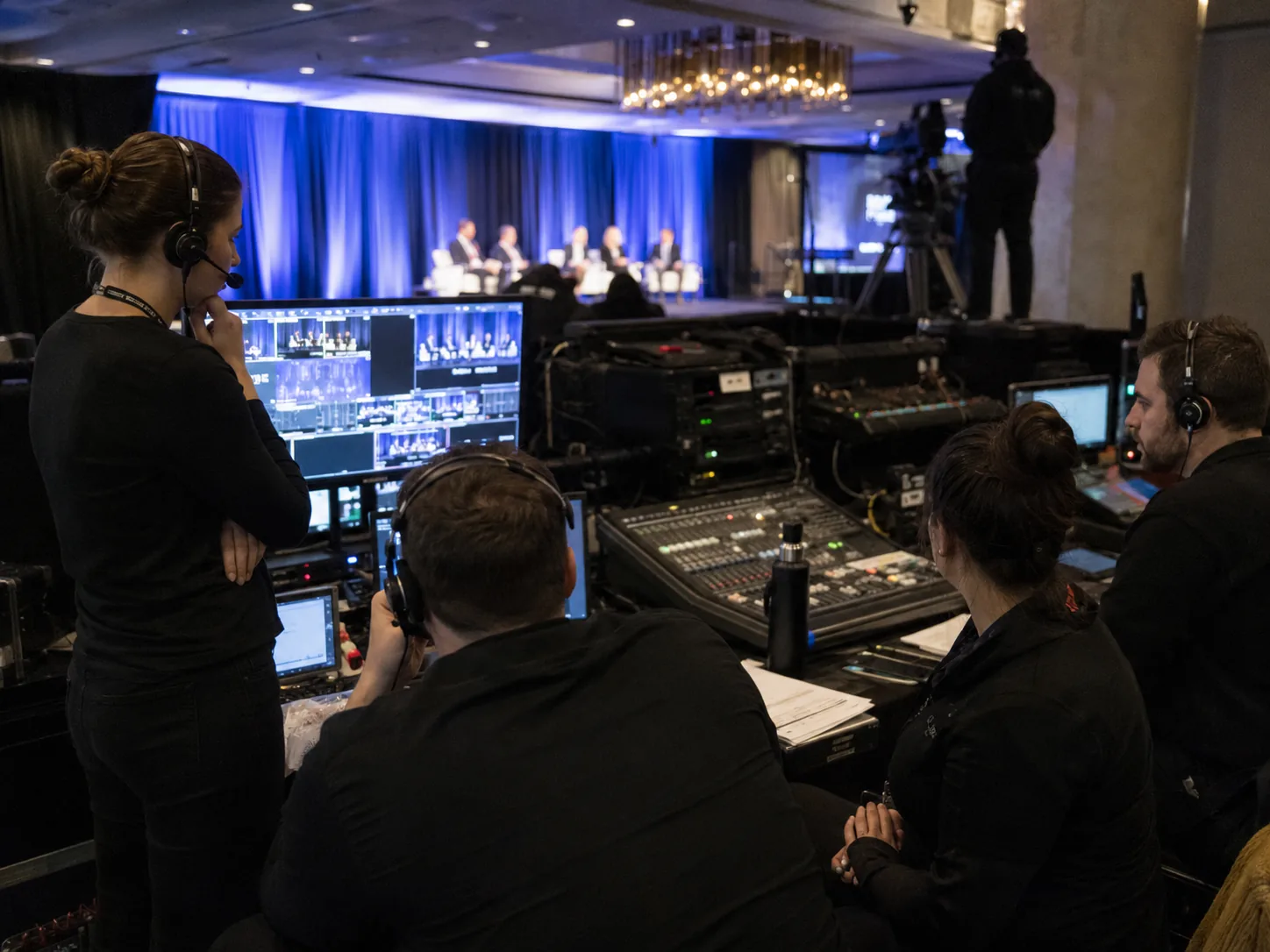 Corporate event management team coordinating production
